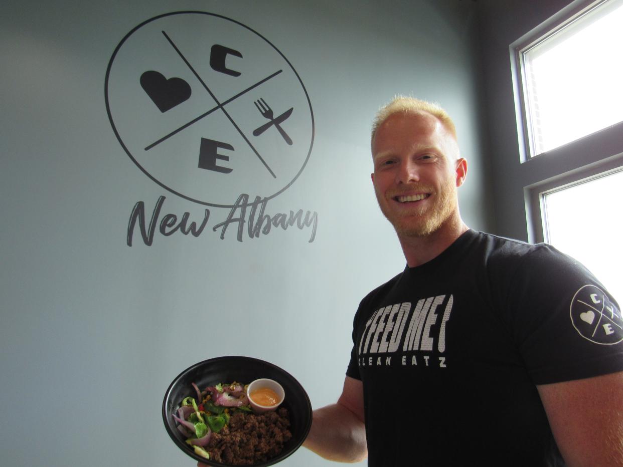 Casey Schroeder displays a ground-bison bowl with grilled vegetables, brown rice and buffalo sauce at his third Clean Eatz, which recently opened at 5673 N. Hamilton Road near New Albany.