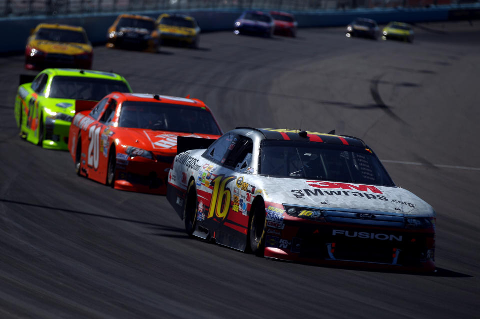 AVONDALE, AZ - MARCH 04: Greg Biffle, driver of the #16 3MWraps.com Ford, drives ahead of Joey Logano, driver of the #20 The Home Depot Toyota, during the NASCAR Sprint Cup Series SUBWAY Fresh Fit 500 at Phoenix International Raceway on March 4, 2012 in Avondale, Arizona. (Photo by Justin Edmonds/Getty Images for NASCAR)