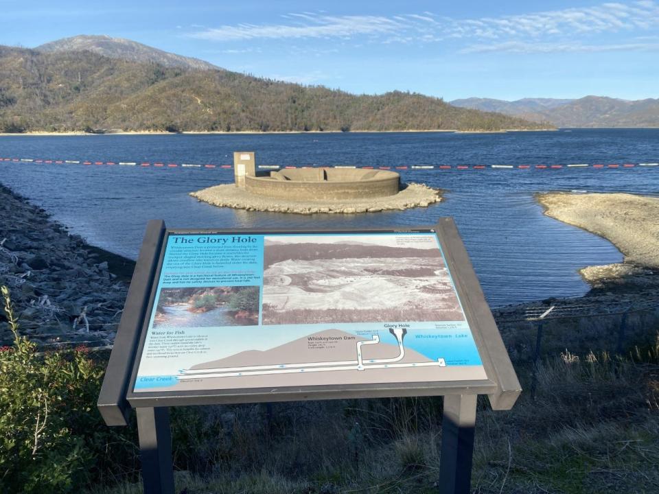The Glory Hole (background) in 2021. The trumpet-shaped hole is an overflow drain in Whiskeytown Lake at Whiskeytown National Recreation Area in Redding.