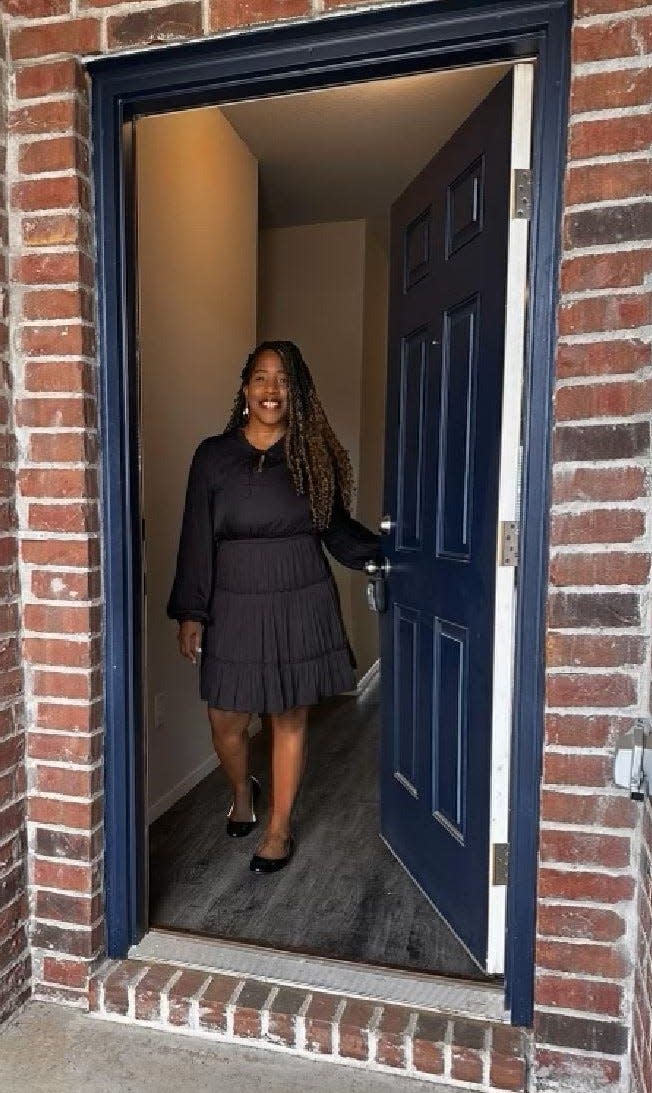 Joan Minor, Fort Smith realtor, stands in the doorway of a home for sale. Minor will help others learn how to become first-time homeowners at a Sebastian County NAACP homebuying event April 29