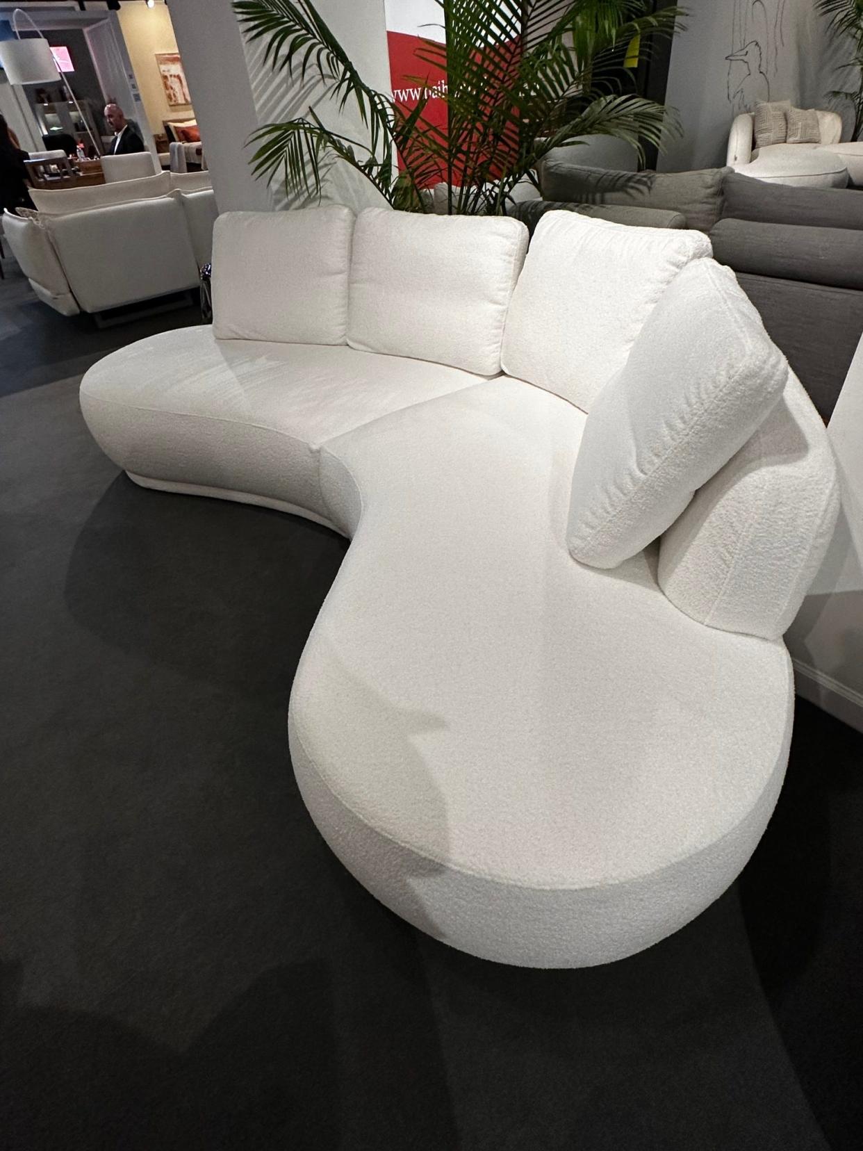 Organic curves of a sofa featured at High Point's Polish Furniture Association reflects organic curves that help reduce stress.