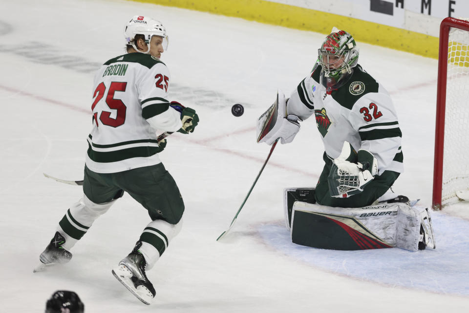 Minnesota Wild goaltender Filip Gustavsson (32) watches the puck after blocking a shot by the Carolina Hurricanes during the second period of an NHL hockey game Saturday, Nov. 19, 2022, in St. Paul, Minn. (AP Photo/Stacy Bengs)