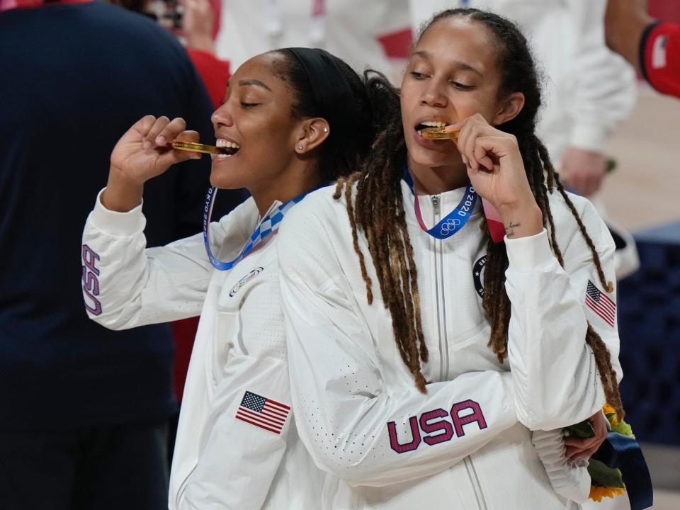 Brittney Griner and A'ja Wilson celebrate winning gold at the Tokyo Olympics.