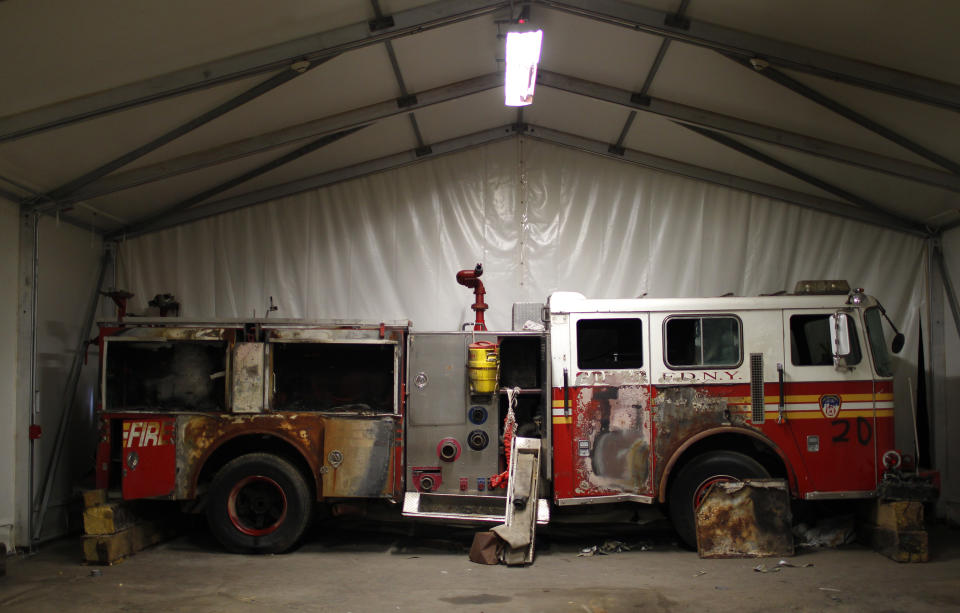 A New York City Fire Department engine recovered from the World Trade Center disaster site sits inside Hangar 17 at New York's John F. Kennedy International Airport June 16, 2011. A program operated by the Port Authority of New York and New Jersey, The World Trade Center steel program, is selecting portions of the steel recovered from the Center and donating it to cities, towns, firehouses and museums around the U.S. and the world who request it for use in 911 memorial sites in time for the 10 year anniversary of the 2001 attacks. Picture taken June 16, 2011. (REUTERS/Mike Segar)