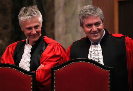 Belgian Public Prosecutors Yves Moreau and Bernard Michel are seen during the trial of Mehdi Nemmouche and Nacer Bendrer in Brussels, Belgium March 11, 2019. REUTERS/Yves Herman/Pool