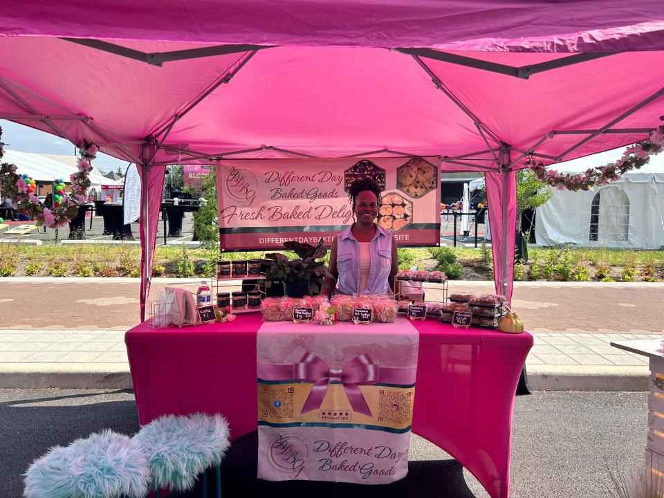 DaShonda Patterson poses while selling her baked goods. Different Day Baked Goods started after Patterson baked brownies for her daughter and found she loved it.