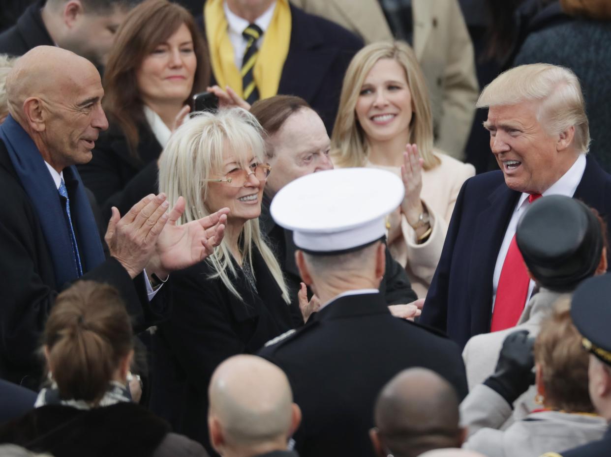 Thomas Barrack, left, with Miriam and Sheldon Adelson, greet Donald Trump in front of the US Capitol on the day of his inauguration as president, on 20 January, 2017 (Getty Images)