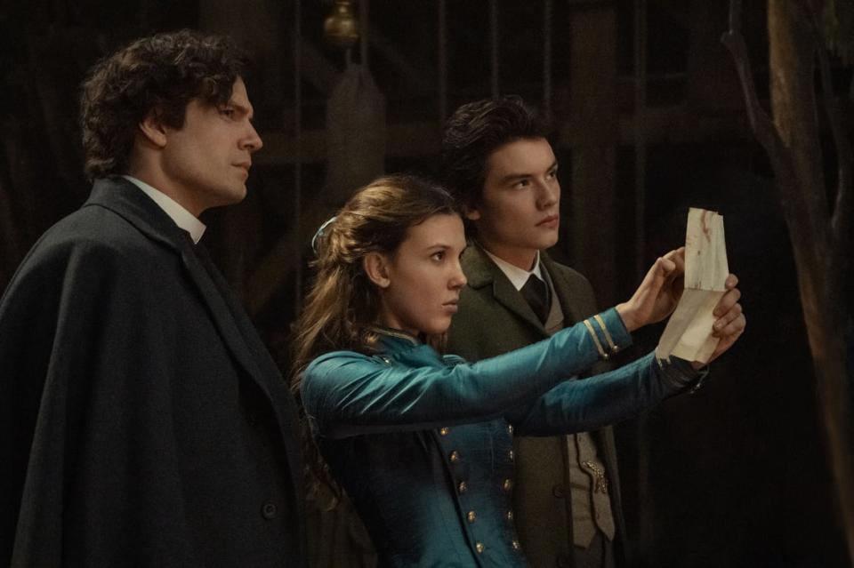 <div class="inline-image__caption"><p>Henry Cavill, Millie Bobby Brown, and Louis Partridge in <em>Enola Holmes 2</em>.</p></div> <div class="inline-image__credit">Alex Bailey/Netflix</div>