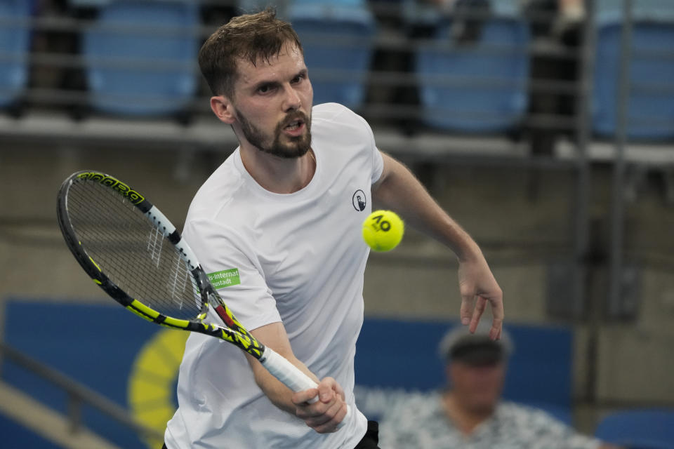 Germany's Oscar Otte plays a forehand return to Dalibor Svrcina of the Czech Republic during their Group C match at the United Cup tennis event in Sydney, Australia, Sunday, Jan. 1, 2023. (AP Photo/Mark Baker)