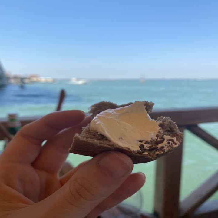 bread roll with whipped butter on it at a restaurant in Venice Italy