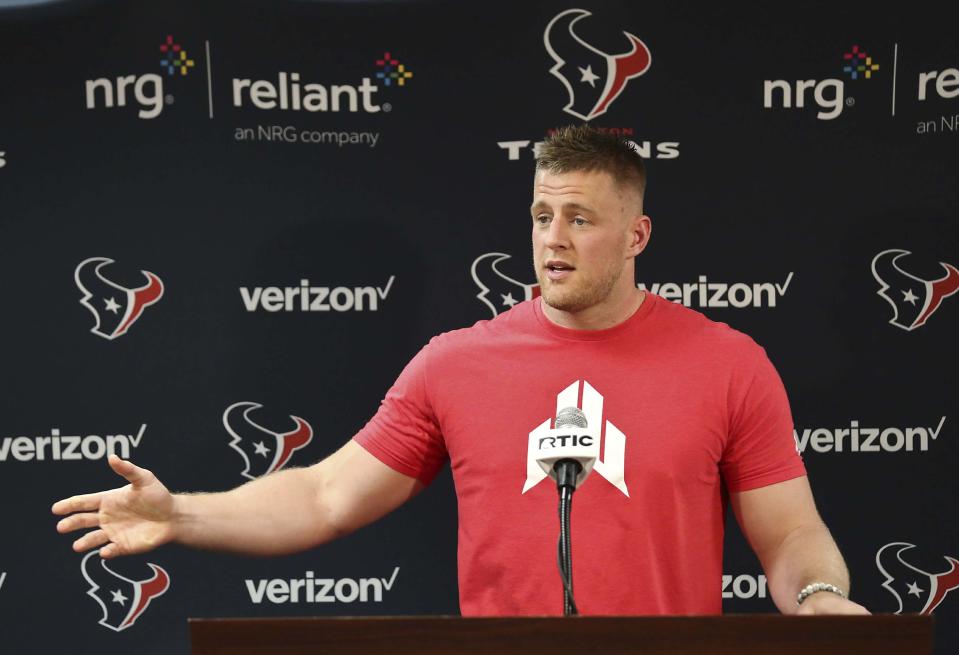 J.J. Watt at a press conference back drop. 