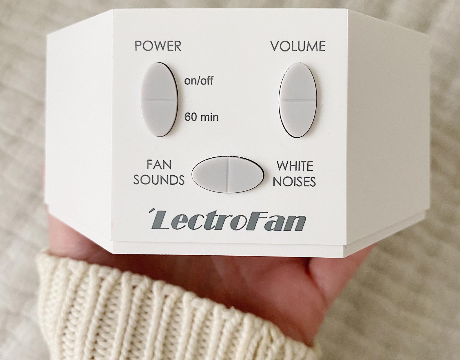 author holding the LectroFan White Noise Machine