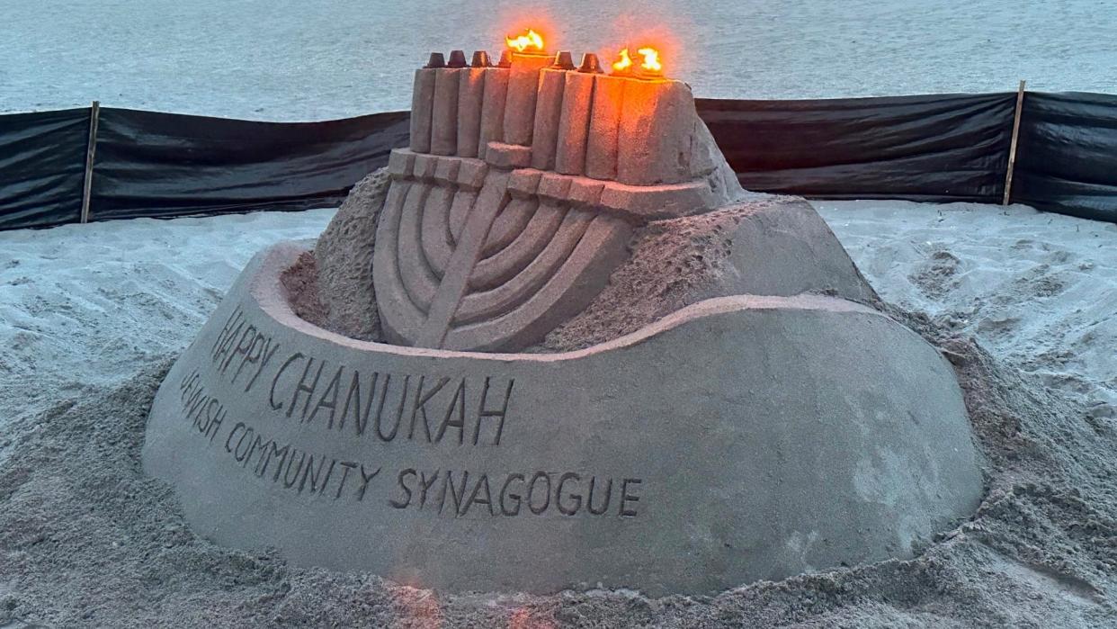 The Jewish Community Synagogue of North Palm Beach had this menorah sculpted from sand near the Juno Beach Pier to celebrate Hanukkah in December 2023. On Tuesday, Dec. 12, a vandal knocked it over and put a swastika in its place. Juno Beach police are investigating.