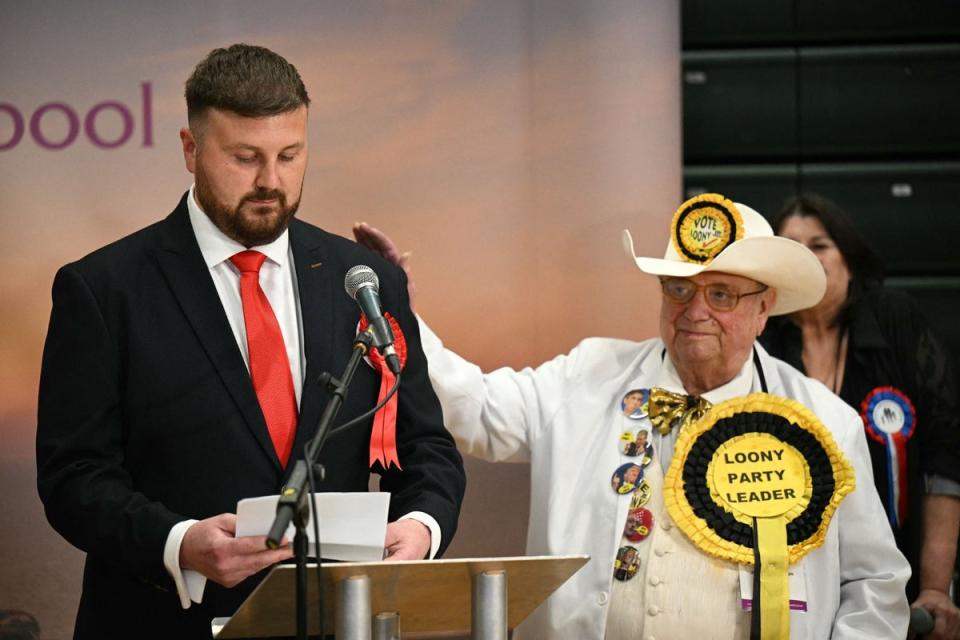 Labour’s new MP for Blackpool South, Chris Webb (L) is congratulated by Monster Raving Loony's Howling Laud Hope as he gives his acceptance speech (AFP via Getty Images)
