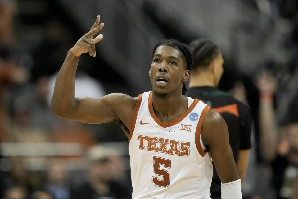 Texas guard Marcus Carr celebrates after scoring against Miami in the second half of an Elite 8 college basketball game in the Midwest Regional of the NCAA Tournament Sunday, March 26, 2023, in Kansas City, Mo. (AP Photo/Charlie Riedel)