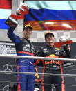 Red Bull driver Max Verstappen of the Netherland's, right, winner, is flanked by second place Toro Rosso driver Daniil Kvyat of Russia on the podium after the German Formula One Grand Prix at the Hockenheimring racetrack in Hockenheim, Germany, Sunday, July 28, 2019. (AP Photo/Jens Meyer)