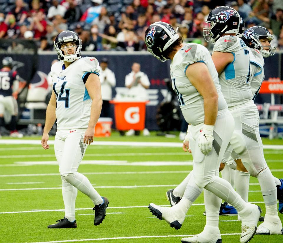 Tennessee Titans kicker Randy Bullock (14) leaves the field after missing a field goal during the first quarter at NRG Stadium Sunday, Jan. 9, 2022 in Houston, Texas.