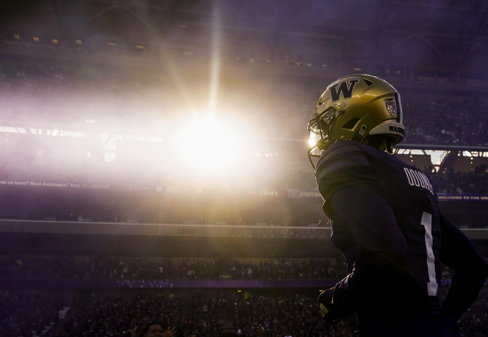 Washington wide receiver Rome Odunze runs out to the field before an NCAA college football game against Washington State, Saturday, Nov. 25, 2023, in Seattle. Washington won 24-21. (AP Photo/Lindsey Wasson)