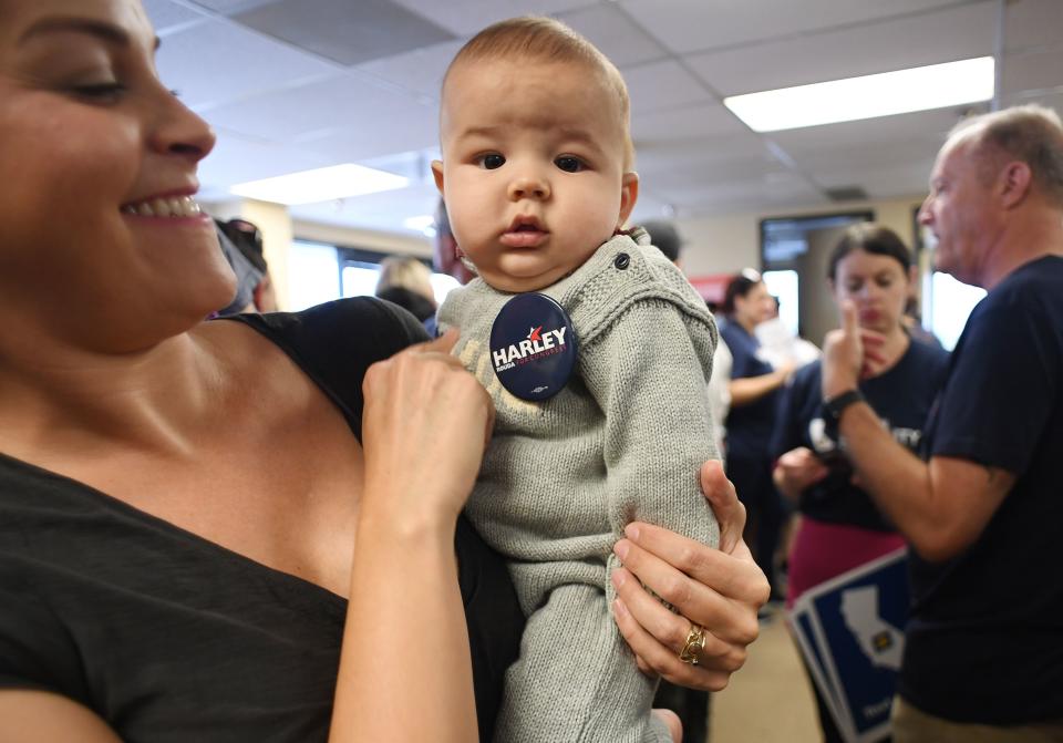 <span class="s1">Dinae Chaves and her 4-month-old son, Enzo, get instructions on canvassing for Democratic candidate Harley Rouda on Oct. 14 in Huntington Beach, Calif. (Photo: Robyn Beck/AFP/Getty Images)</span>
