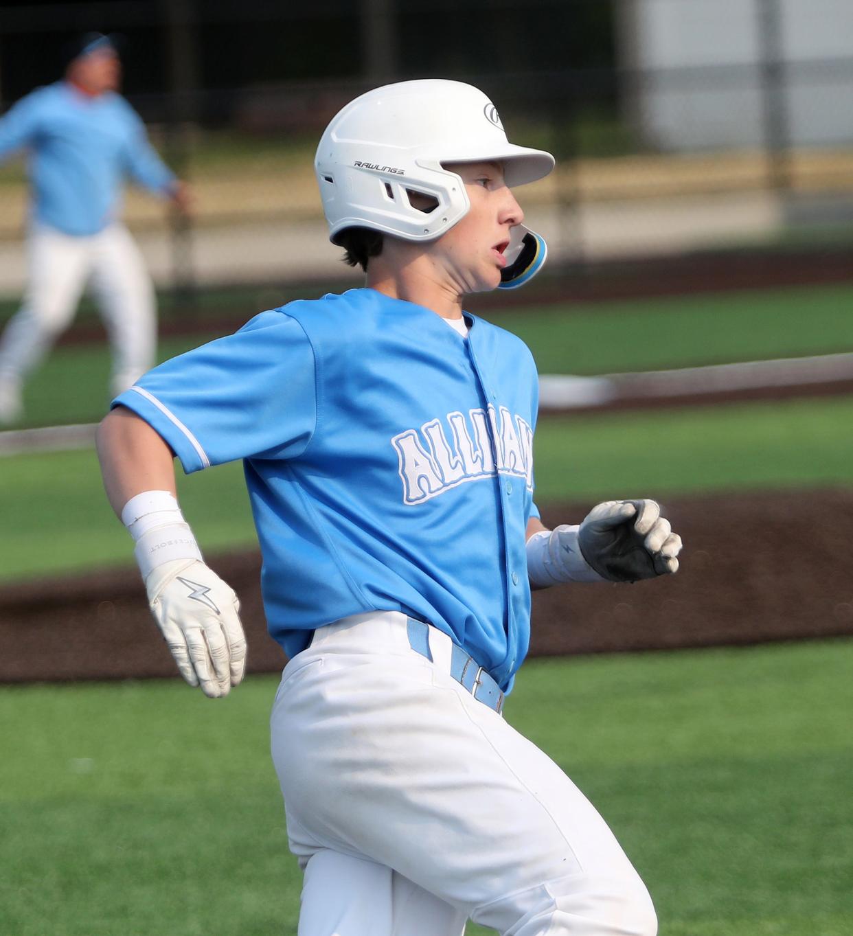 Alliance's Bo Davis rounds first base after a hit against ND-CL during a sectional final, Wednesday, May 17, 2023.