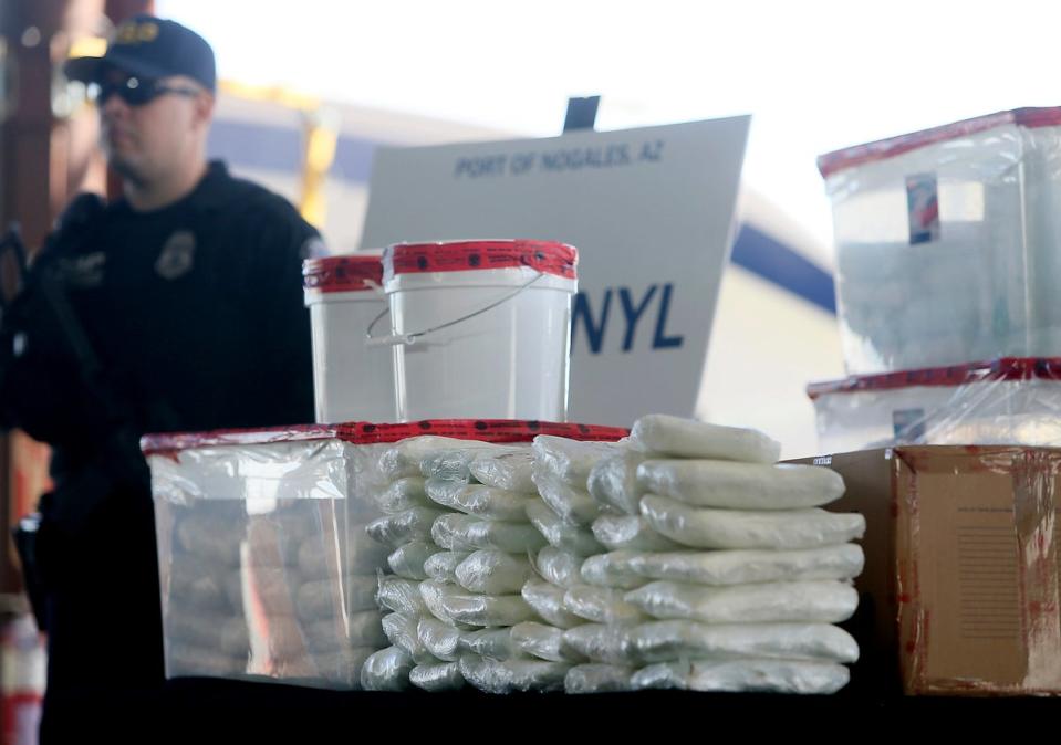 US Customs and Border Protection officers display the haul from a seizure of fentanyl and methamphetamines at the border in Nogales, Arizona (Arizona Daily Star)