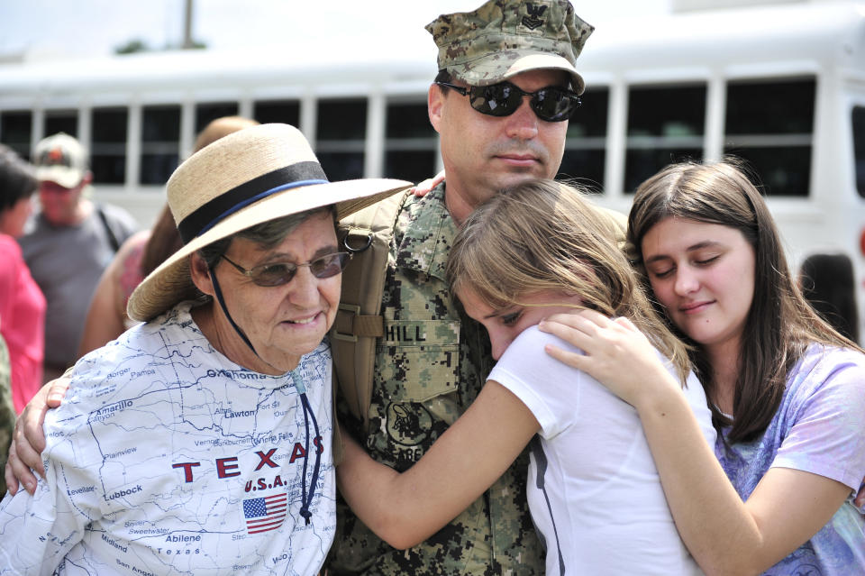 Information Systems Technician 1st Class Milton Hill assigned to Naval Mobile Construction Battalion (NMCB) 11 is greeted by family during a homecoming ceremony at Naval Construction Battalion Center.&nbsp;