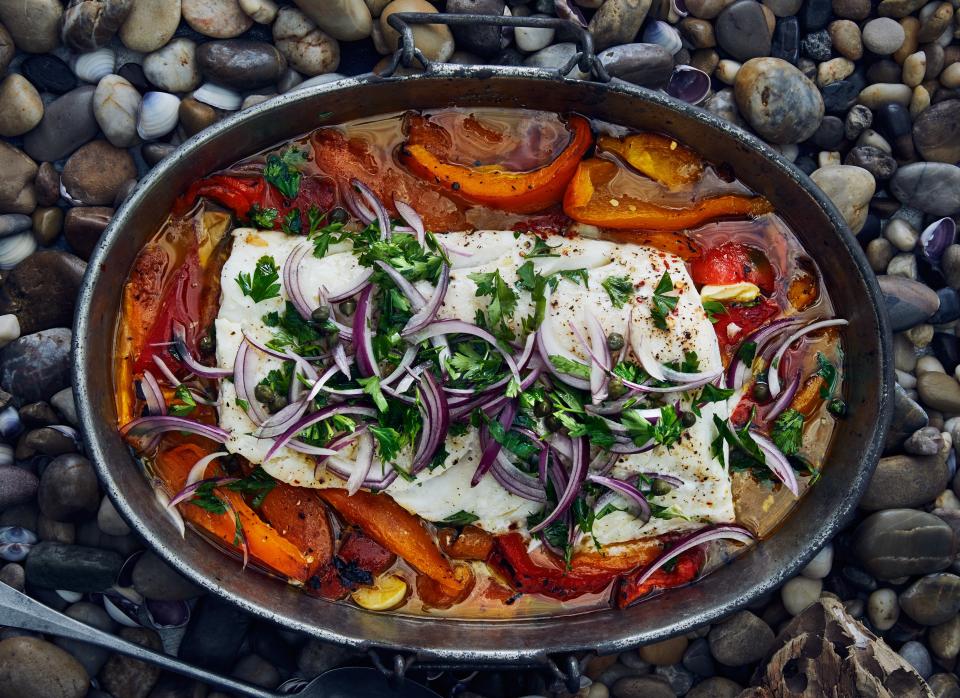 For this slow-roasted cod recipe, if you get a fillet that includes the thin, tapered tail end of the cod, fold it underneath so the fillet will cook evenly. <a rel="nofollow noopener" href="https://www.bonappetit.com/recipe/slow-roasted-cod-with-bell-peppers-and-capers?mbid=synd_yahoo_rss" target="_blank" data-ylk="slk:See recipe.;elm:context_link;itc:0;sec:content-canvas" class="link ">See recipe.</a>