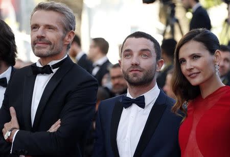 (L-R) Actors Lambert Wilson, Guillaume Gouix and Virginie Ledoyen, cast members of the film "Enrages" (Rabid Dogs), pose on the red carpet as they arrivefor the screening of the animated film "Inside Out" (Vice Versa) out of competition at the 68th Cannes Film Festival in Cannes, southern France, May 18, 2015. REUTERS/Regis Duvignau