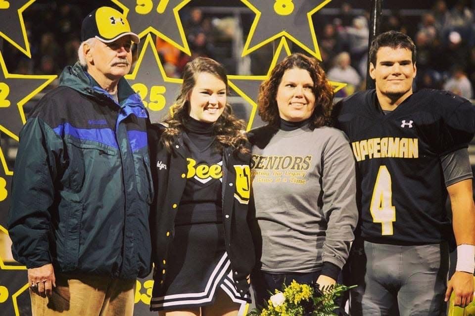 From left, longtime Upperman fan and booster JT Butler, daughter Ashlynn, ex-wife Donna and son Joey. JT Butler died after collapsing on the sideline moments after Upperman's 21-14 Class 4A semifinals win at Greeneville last week. He was 76.