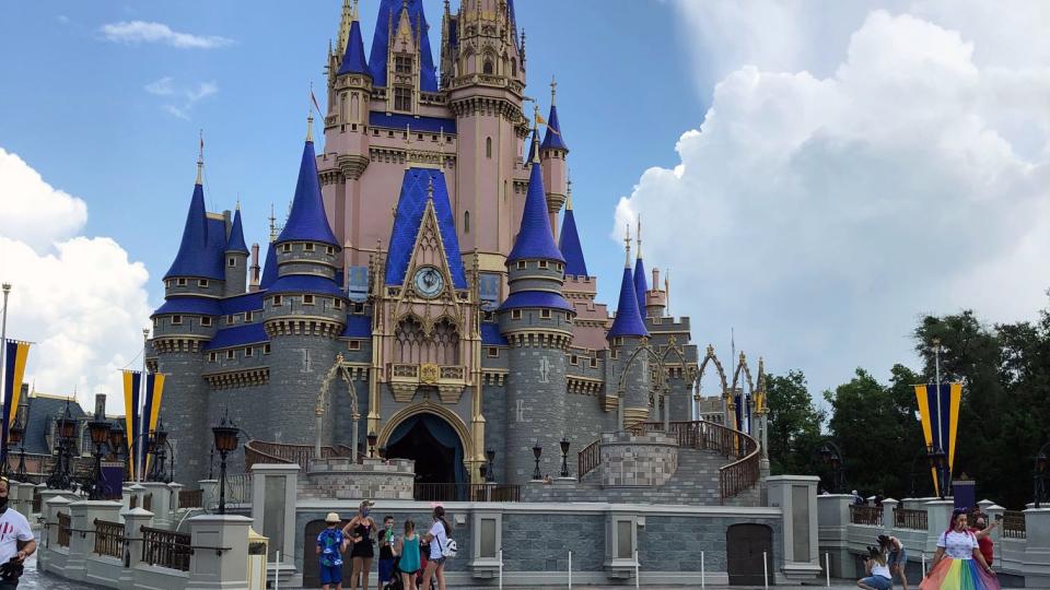 The skies over Cinderella's Casatle brightened following a brief downpour.