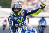 Yamaha MotoGP rider Valentino Rossi of Italy celebrates his victory after the race at the TT Assen Grand Prix at Assen, Netherlands June 27, 2015. REUTERS/Ronald Fleurbaaij