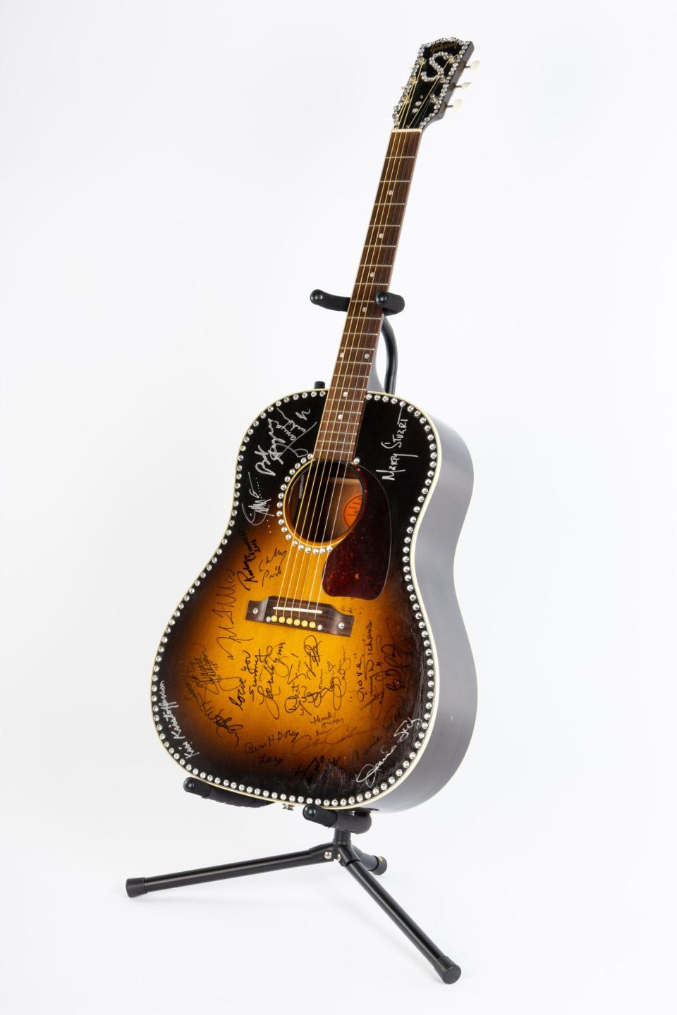 Sunny Sweeney has used this customized Gibson J-45 Historic Collection acoustic guitar to write songs, record and perform. The instrument is adorned with rhinestones and the signatures of many of her favorite artists.