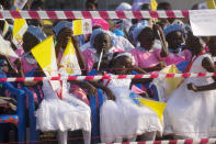 People wait for the arrival of Pope Francis for a meeting with priests, deacons, consecrated people and seminarians at the Cathedral of Saint Theresa in Juba, South Sudan, Saturday, Feb. 4, 2023. Francis is in South Sudan on the second leg of a six-day trip that started in Congo, hoping to bring comfort and encouragement to two countries that have been riven by poverty, conflicts and what he calls a "colonialist mentality" that has exploited Africa for centuries. (AP Photo/Gregorio Borgia)