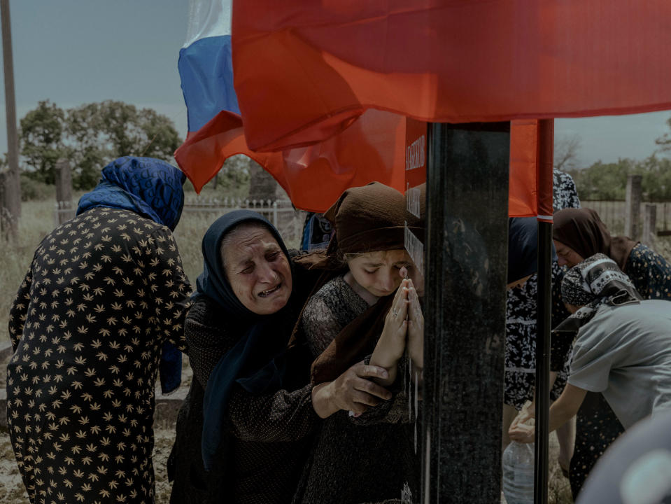 Women mourn the death of their family member and conscript soldier Gasanbek Agabekov, who was killed in Ukraine the 27th of May, in Aglobi, Dagestan, Russia, on June 16. In Dagestan, family members of the deceased meet at regular intervals to grieve. An imam said that fifteen other men from Gasanbek’s area had died in the war. The republic that has seen the most war is also one of poorest republics in the Russia.<span class="copyright">Nanna Heitmann—Magnum Photos</span>