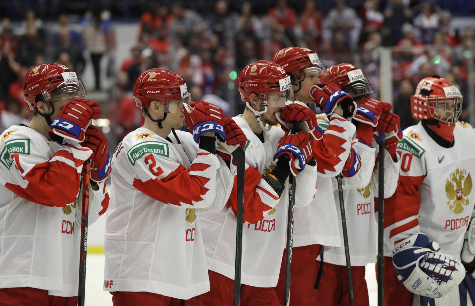 Russia's player stand on ice after loosing the U20 Ice Hockey Worlds gold medal match between Canada and Russia in Ostrava, Czech Republic, Sunday, Jan. 5, 2020. (AP Photo/Petr David Josek)