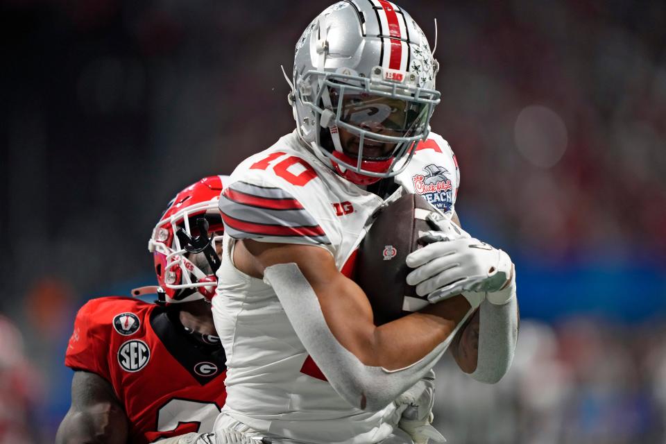 Ohio State wide receiver Xavier Johnson makes a touchdown catch as Georgia linebacker Smael Mondon Jr. attempts to defend.