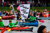 <p>Protest boats pass demonstrators on the Alster river during a demonstration called by several NGOs ahead of the G20 summit in Hamburg on July 2, 2017. (John MacDougall/AFP/Getty Images) </p>