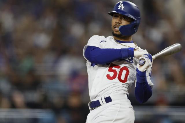 Los Angeles Dodgers' Mookie Betts (50) poses for a photo with the