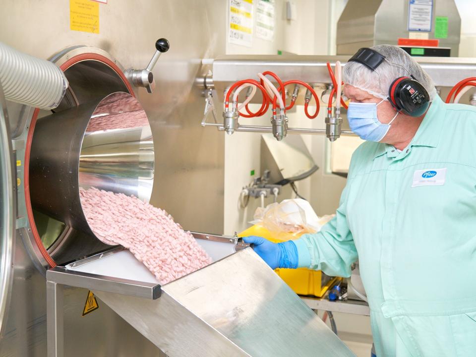 A worker at Pfizer's manufacturing facility in Freiburg, Germany produces the COVID-19 antiviral pill Paxlovid