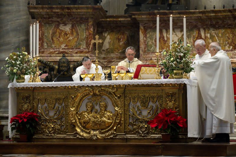 Benedict's top aide leads mass in memory of Pope Emeritus