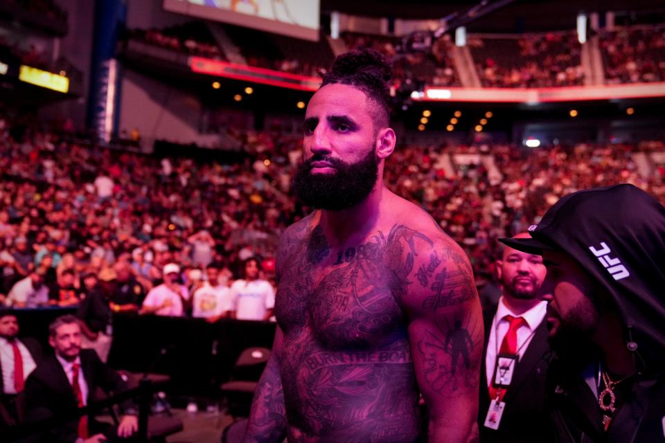 Austen Lane walks to the octagon before his fight against Justin Tafa at UFC Fight Night. The former Jaguars lineman, fighting before a home crowd, had his fight declared a no-contest after only 29 seconds due to an accidental eye poke.
