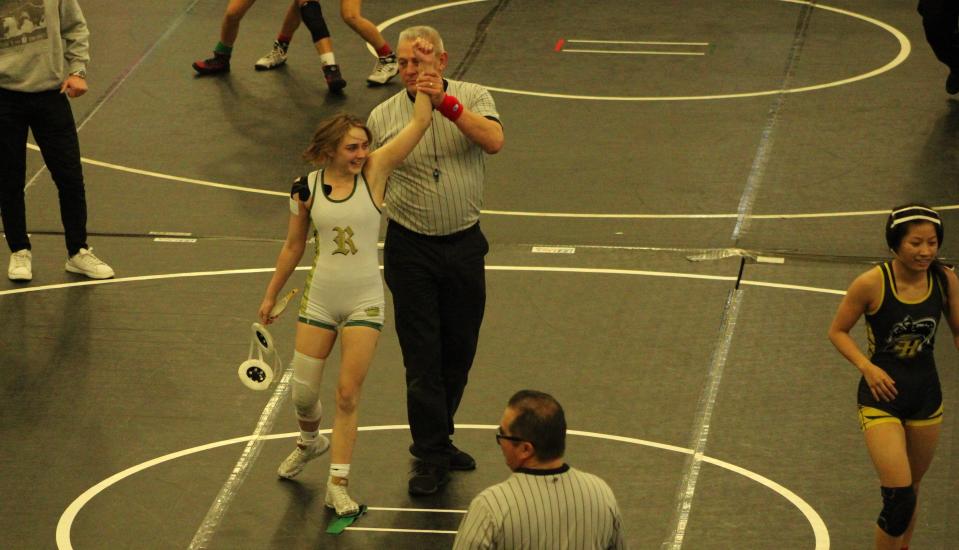 Royal High's Ireland Donnelly celebrates as the referee holds up her arm after she won the championship match of the 111-pound division at the CIF-Southern Section Northern Division Girls Wrestling Individuals at San Dimas High on Saturday.