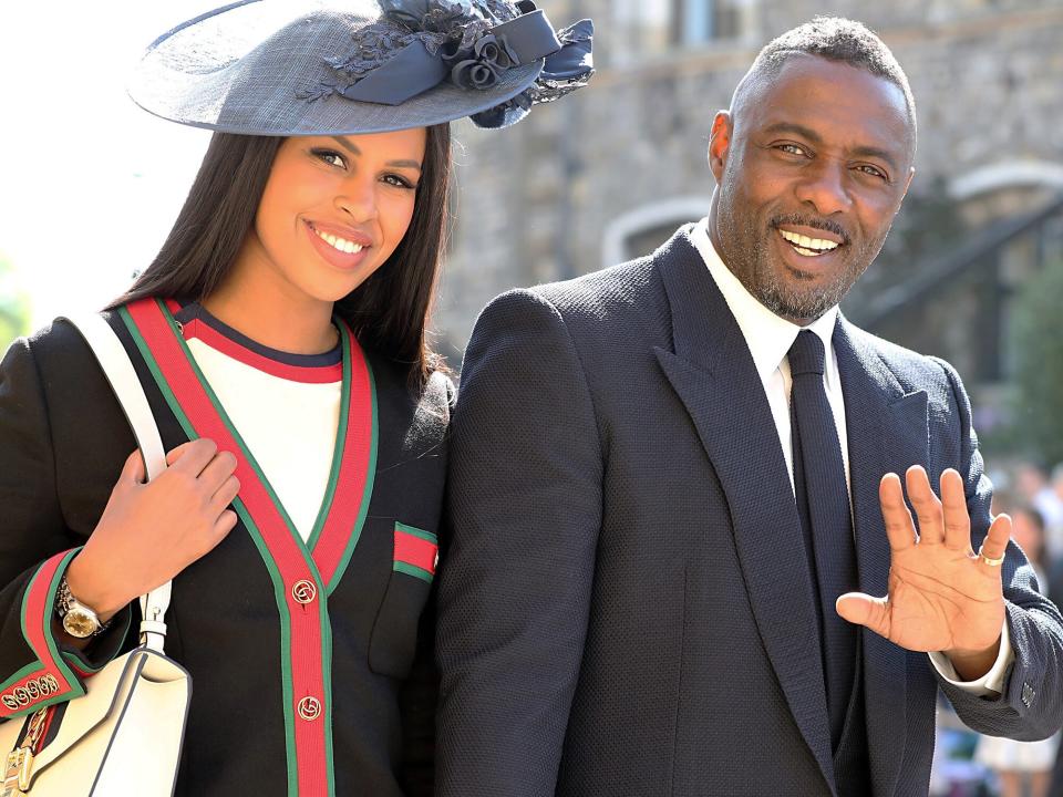 Idris Elba and Sabrina Dhowre arrive at St George's Chapel at Windsor Castle before the wedding of Prince Harry to Meghan Markle on May 19, 2018 in Windsor, England