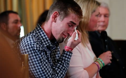 Samuel Zeif, an 18-year-old senior at Marjory Stoneman Douglas High School in Parkland, Fla., cries after speaking during a listening session with President Donald Trump - Credit: JONATHAN ERNST/ REUTERS