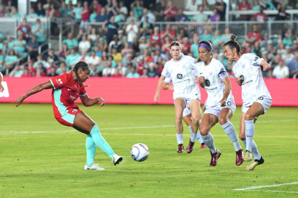 Kansas City Current forward Michelle Cooper (17) scores a goal against Racing Louisville FC during the second half at CPKC Stadium on May 18, 2024.