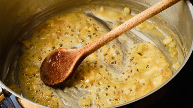 cooking roux in metal pot