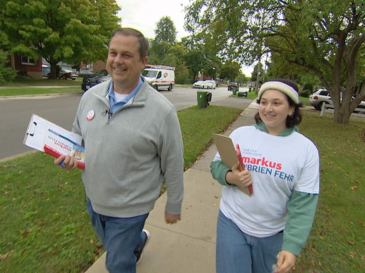 Council candidate Markus O'Brien Fehr canvasses with volunteer Hiva Faghihi in Ward 18, Willowdale. The race between O'Brien Fehr and Lily Cheng, who placed second in the ward in 2018, is believed to be very close. (Paul Borkwood/CBC - image credit)