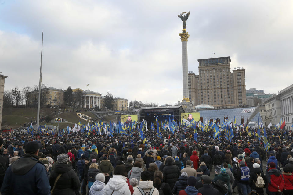 Activists attend a rally in central Kyiv, Ukraine, Sunday, Dec. 8, 2019. Several thousand people rallied Sunday in the Ukrainian capital of Kyiv to demand that the president defend the country's interests in this week's summit with Russia, Germany and France on ending the war in eastern Ukraine. (AP Photo/Efrem Lukatsky)