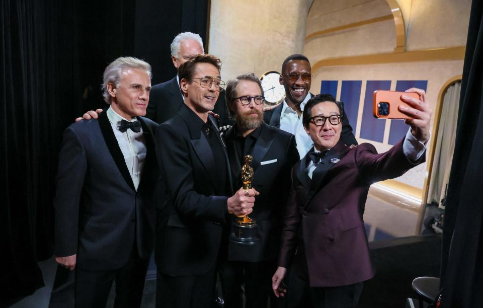 Supporting Actor winner Robert Downey, Jr. surrounded by presenters Christoph Waltz, Tim Robbins, Sam Rockwell, Mahershala Ali and Ke Huy Quan back stage during the the 96th Annual Academy Awards in Dolby Theatre at Hollywood & Highland Center in Hollywood, CA, Sunday, March 10, 2024.