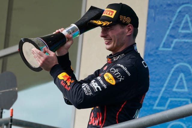 Max Verstappen celebrates winning for a 13th time this season 